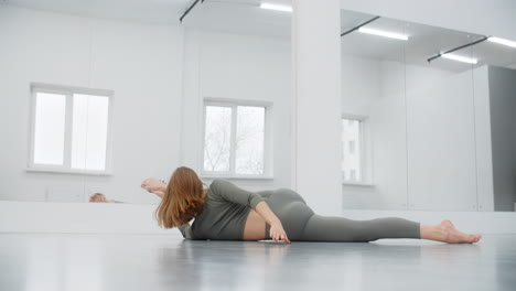woman stretching in a dance studio