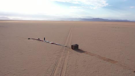 aerial view of some men preparing the launch of a balloon in the desert