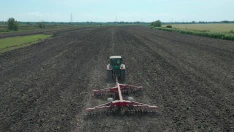 the tractor is plowing the field