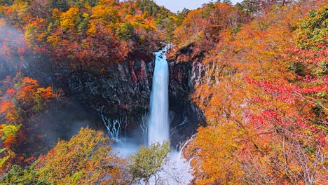 4k.time lapse  of kegon waterfall in autumn foliage, nikko, tochigi, japan