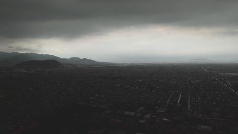 see ecatepec from above during wet season, filmed by drone