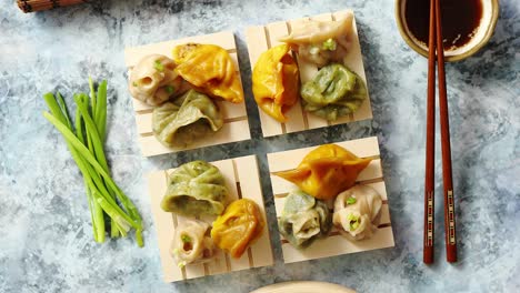 Delicious-mixed-kinds-of-chinese-dumplings-served-on-wooden-stands