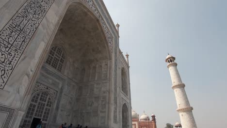 tourists visit the taj mahal in  india. tilt down shot