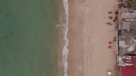 tranquil beach with gentle waves and vacant sandy shore in koh lanta, drone footage