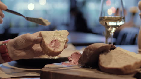 Woman-eating-bread-with-meat-paste-in-the-cafe