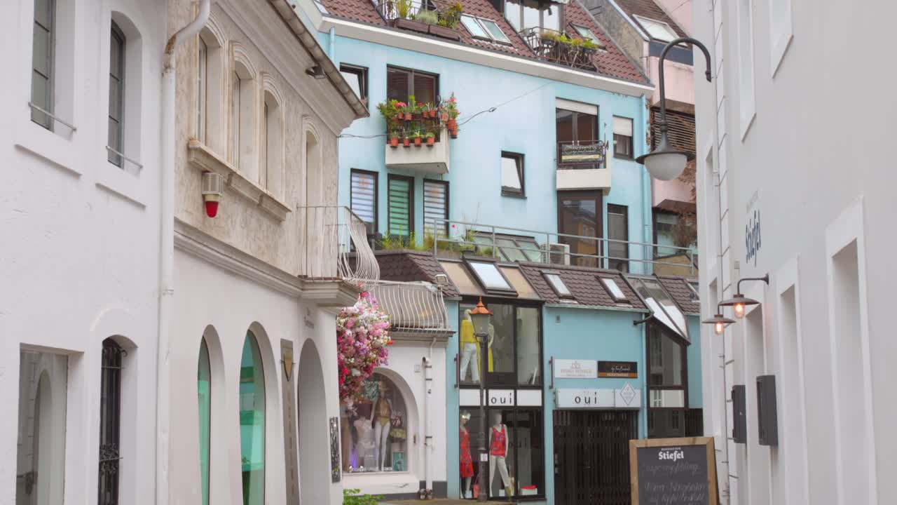 Profile view of an alley in Sarrebrucken, Germany with beautiful architecture details of buildings and apartments. 4k.