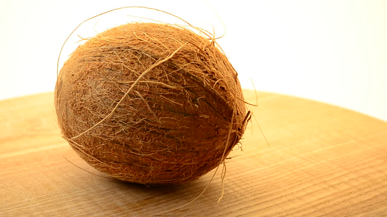 Shooting of coconut. Coco in a section, juice