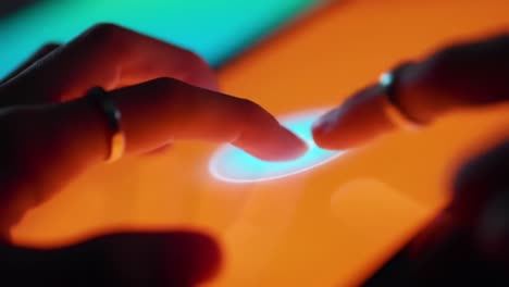 exploring interactive touch technology: close-up of a user's finger engaging with a vibrant touchscreen interface displaying dynamic visual elements