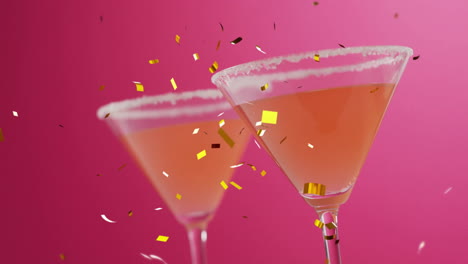 Animation-of-confetti-falling-and-cocktail-on-pink-background