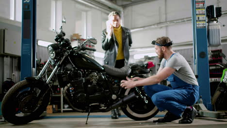 mechanic working on a motorcycle