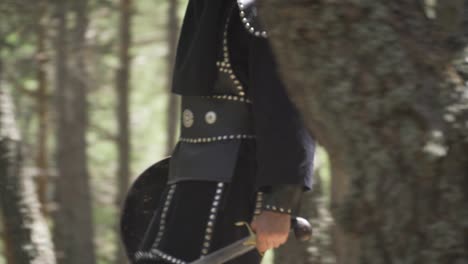 soldier walking in the forest with sword and shield in hand.