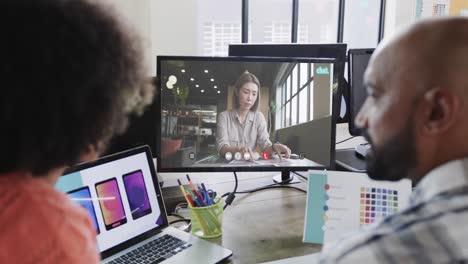 african american business people on video call with caucasian female colleague on screen