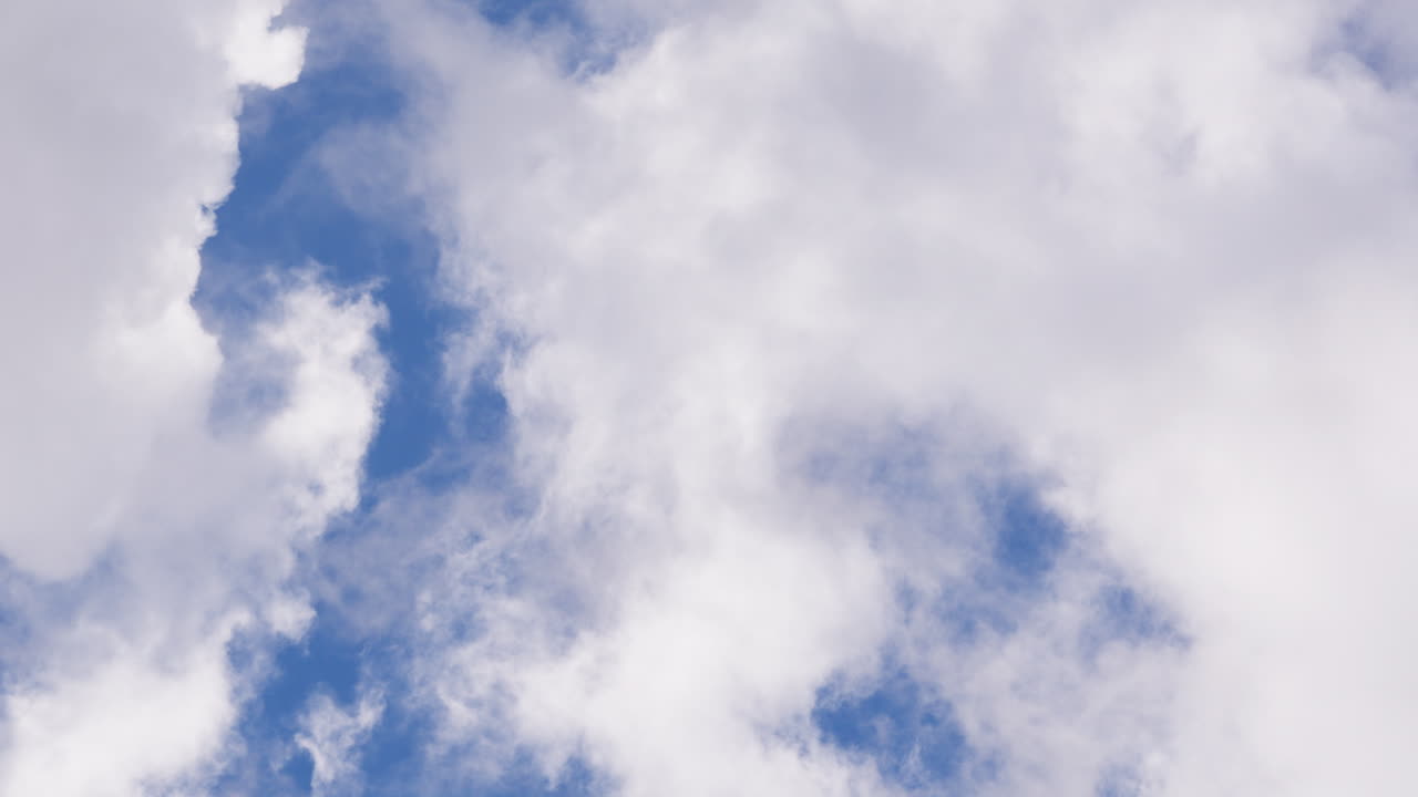 Blue sky with fluffy clouds, serene nature, sense of calm and beauty