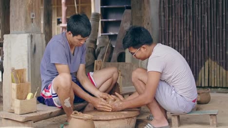 man potter teaching the art of pot making, video in 4k