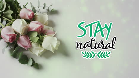 Animation-of-stay-natural-text-over-bunch-of-roses