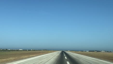 real time take off as seen by the pilots in a sunny summer day with the sea ahead