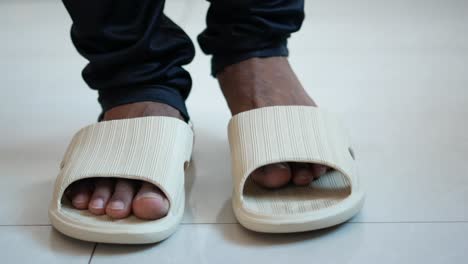 man wearing beige sandals