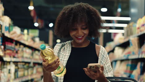 woman shopping for oil in grocery store
