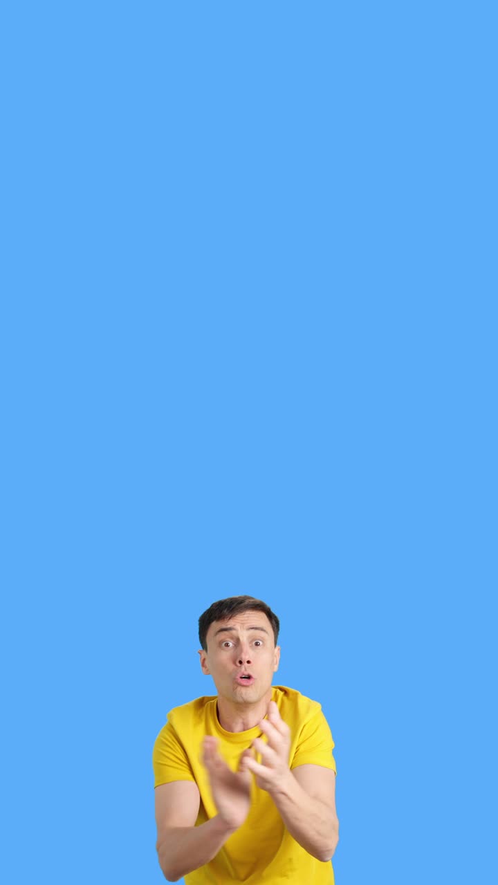 Man dancing in yellow shirt