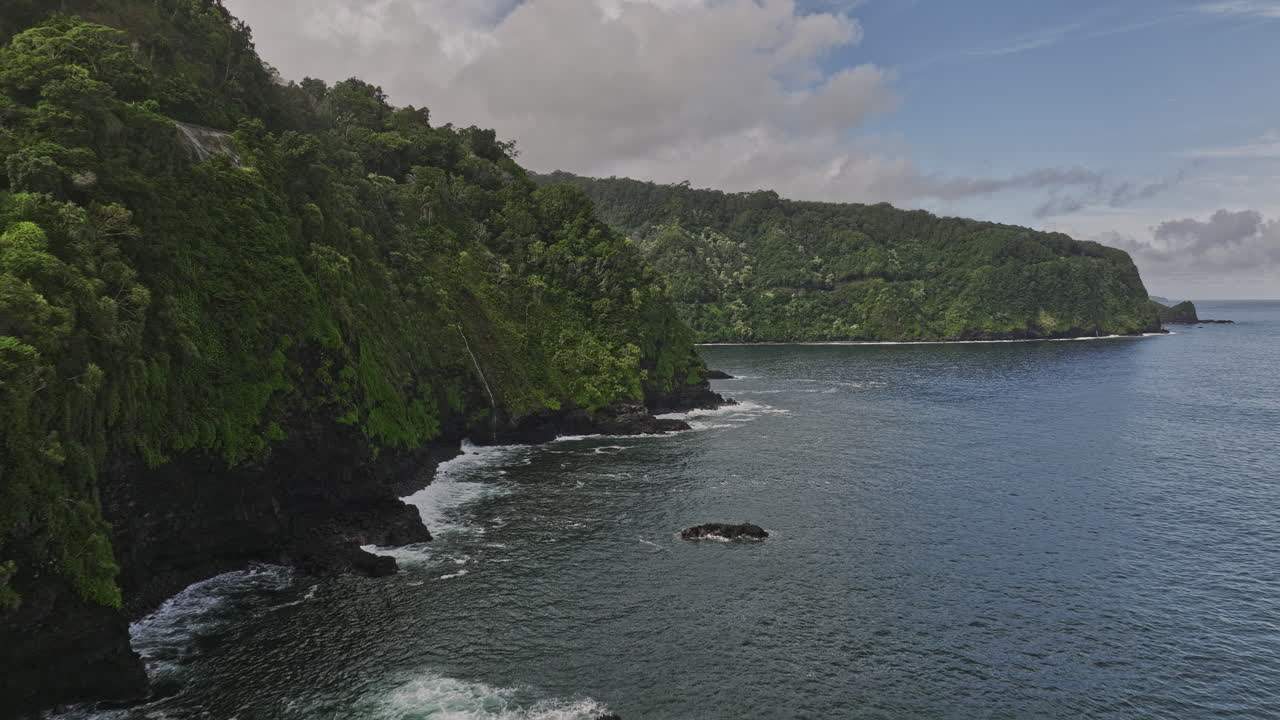 Maui Hawaii Aerial v41 flyover Nua&lsquo;ailua Bay surrounded by rugged lava rock formations, lush tropical vegetation with river stream flowing into the sea - Shot with Mavic 3 Cine - December 2022