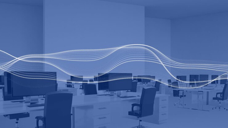 Animation of financial data processing over computers on desks in office and blue background