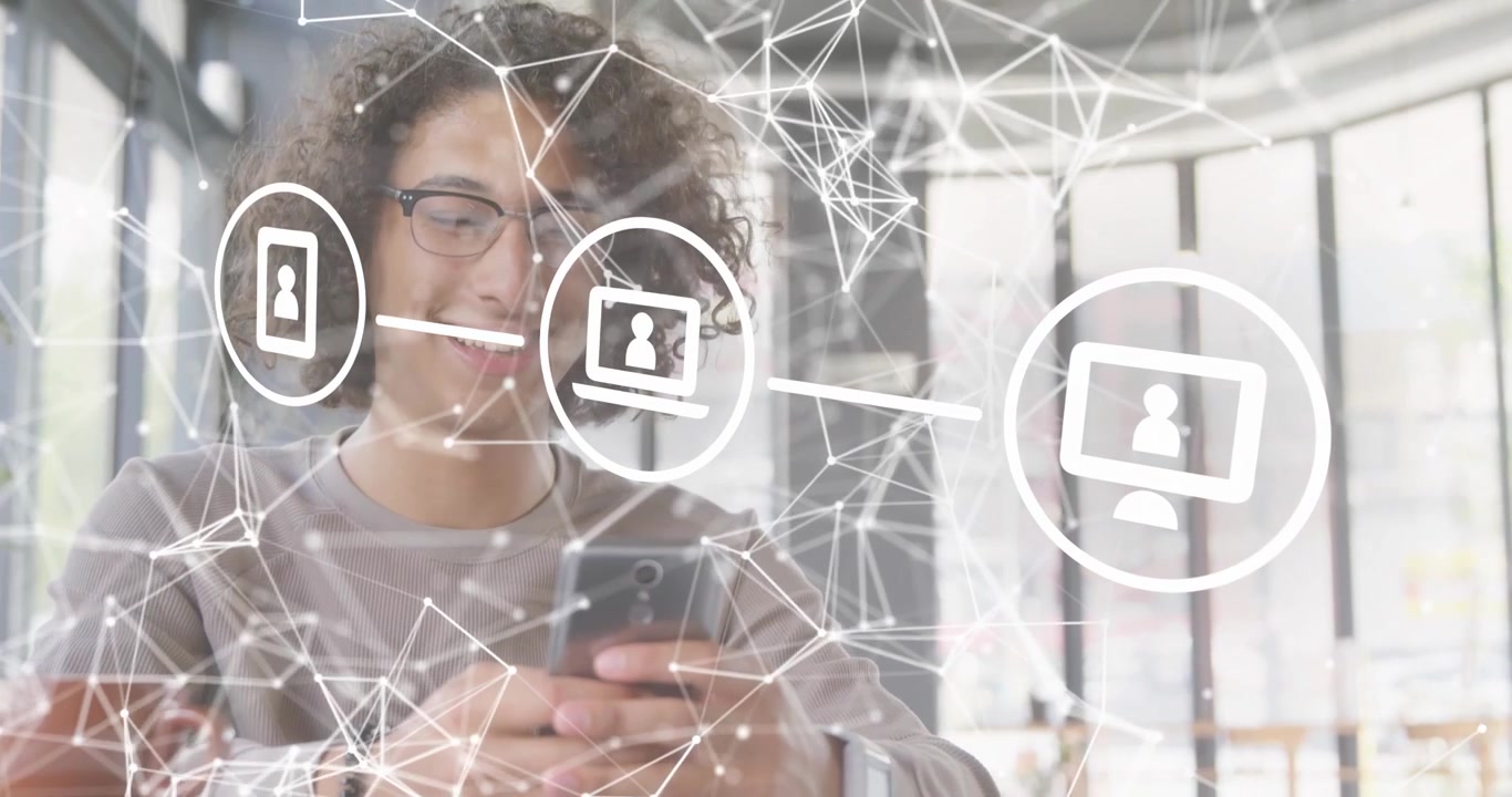 Tech worker tapping smartphone screen activating network overlay visualizing data flow to devices