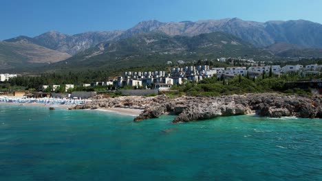 rocky coastline and tranquil beaches washed by the blue turquoise ionian sea, resorts and hotels in albania