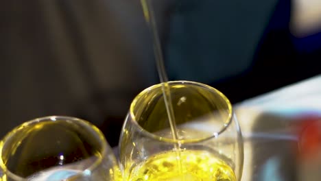 pouring drink in glass closeup view