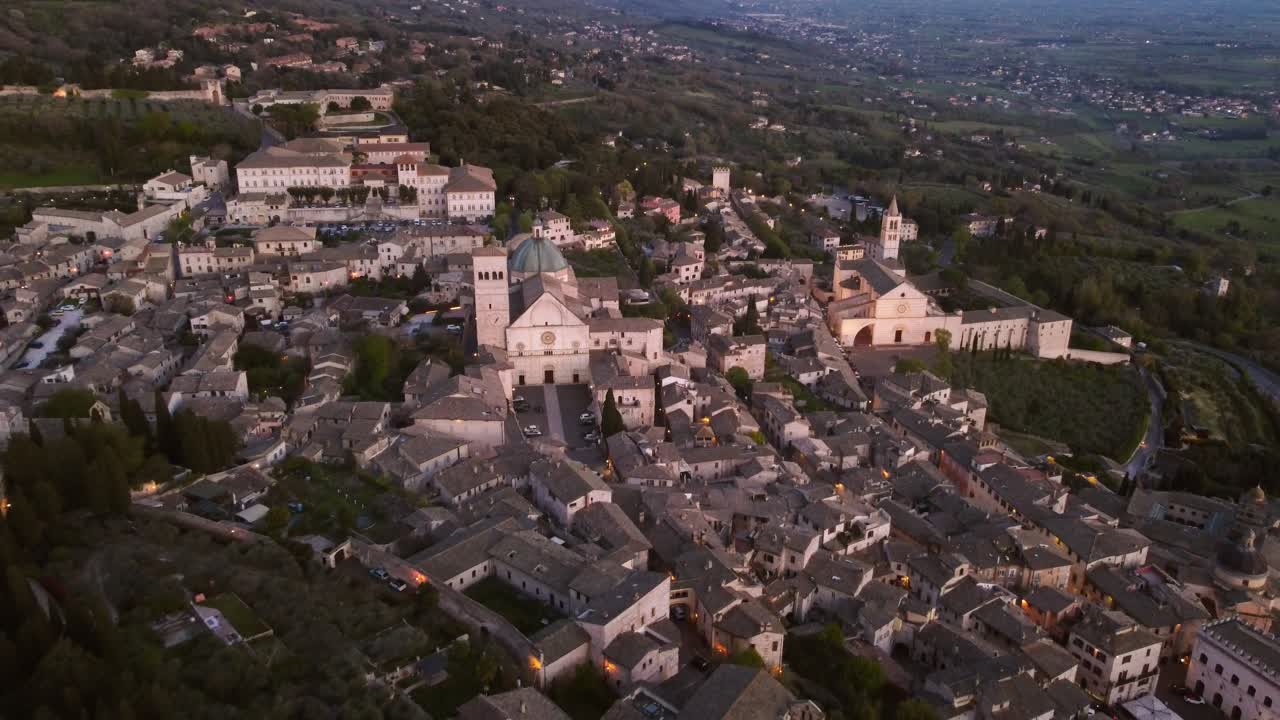 Backwards aerial of Basilica's San Ruffino and Santa Chiara, Assisi, 4k