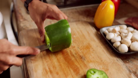 cuchillo de chef, mano y pimienta de cocina