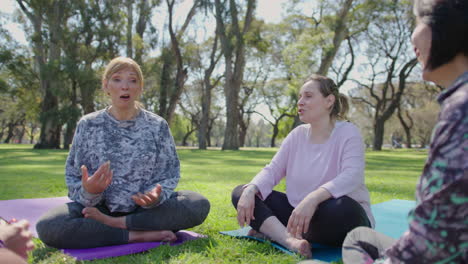 women friends enjoying a yoga session in a park