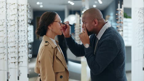 woman getting her eyes examined by an optometrist