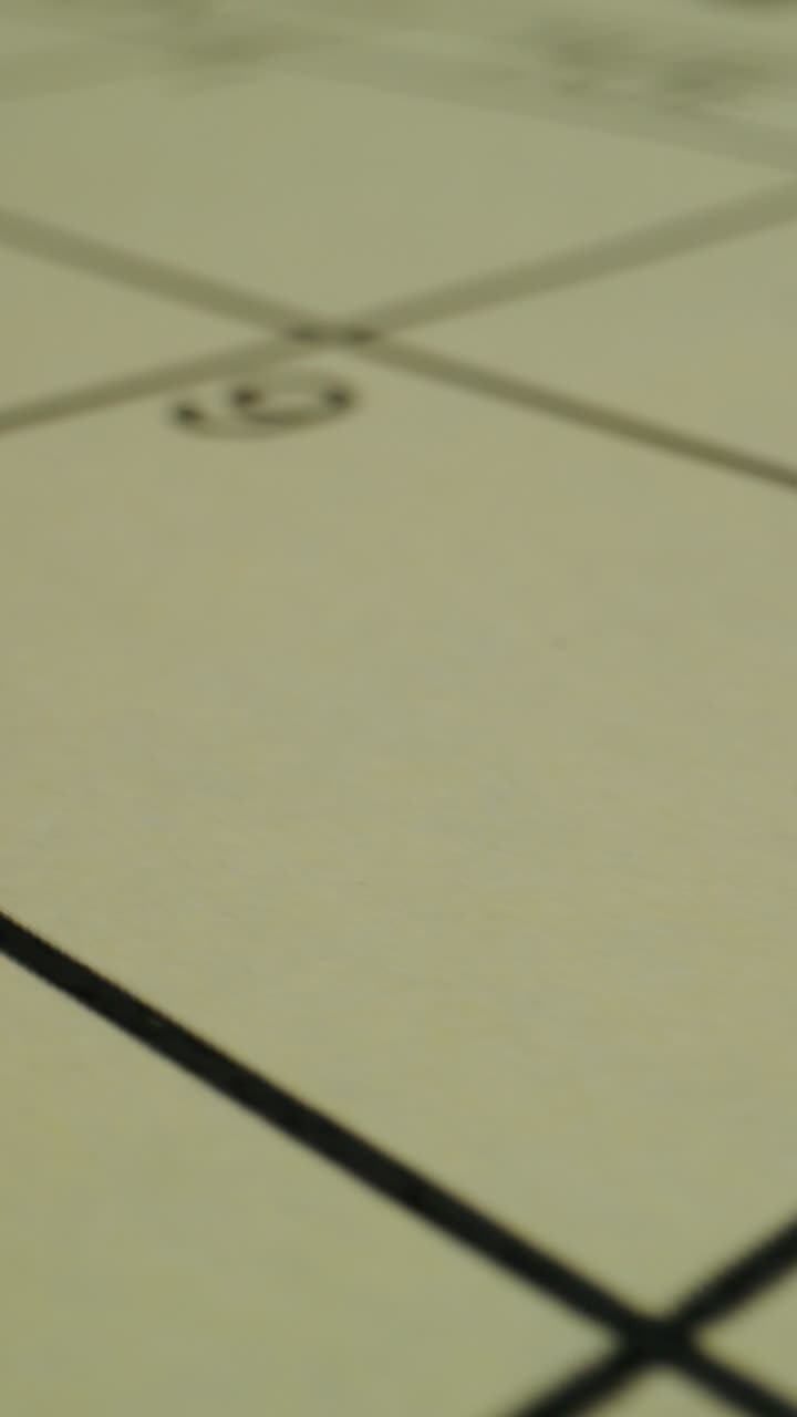 Close-up of a light beige surface with grid lines and markings