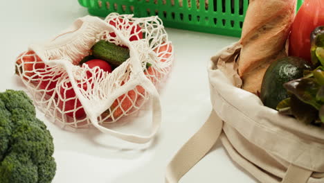 fresh produce and bread in reusable bags
