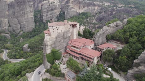 breathtaking aerial of rousanou monastery on top of rocky precipice, meteora