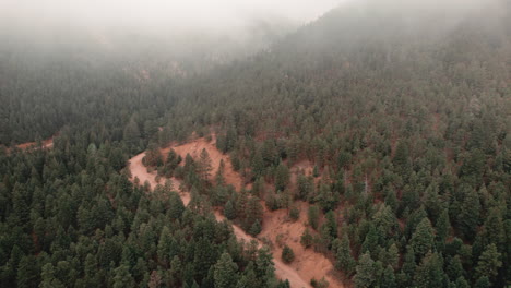 portion of cheyenne valley trail in colorado, covered in mist, aerial view