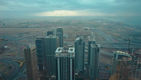 4K:-Skyscrapers-of-Dubai's-JLT-district-with-modern-buildings