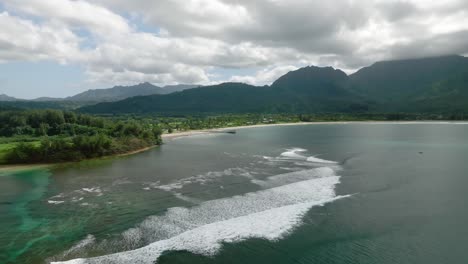 panoramic aerial over hanalei bay beach in hawaii, at cloudy summer day