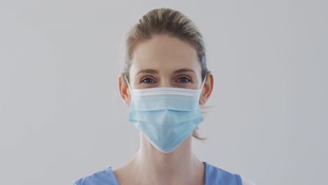 female health worker wearing face mask at home