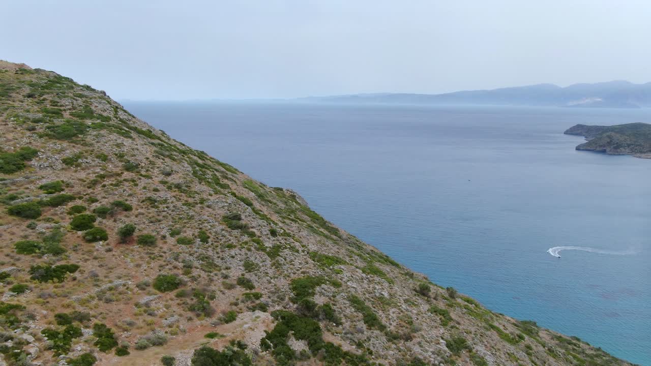 panoramic view hills, Mediterranean sea, Crete island, Lasithi. Aerial forward