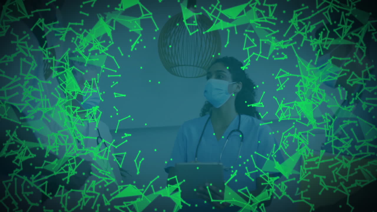 Masked medical team reviewing tablet with stethoscopes in corridor, showing green network overlay