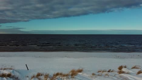 Aerial-View-at-the-Baltic-Sea,-Winter-Season-Landscape-by-the-Sea-in-Sunny-Day