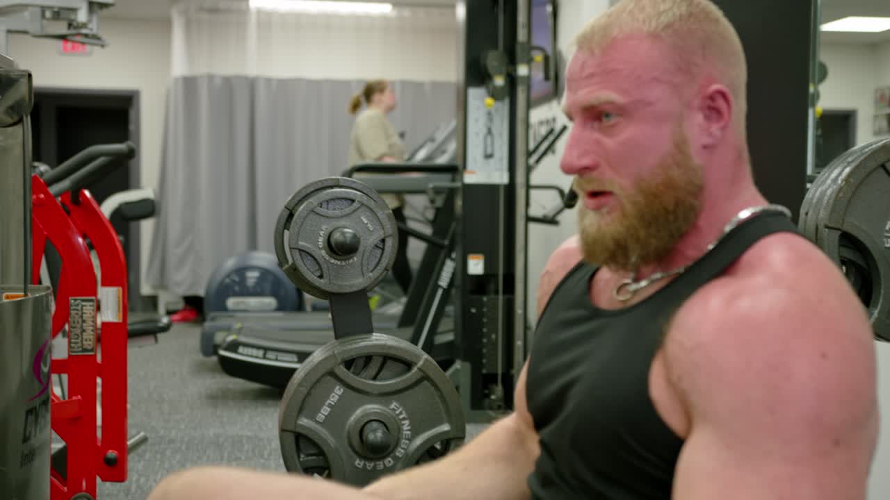 Muscular bodybuilder handsome men doing exercises in gym