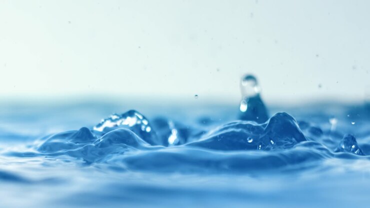Rain water drops falling in super slow motion.