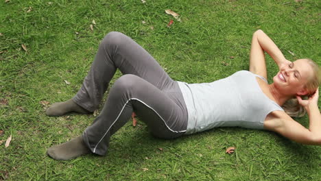 a woman working out in the park