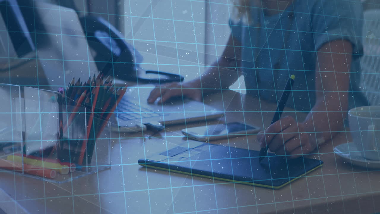 Animation of biometric over hands of caucasian businesswoman using laptop and graphics tablet