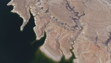 a high-flying drone shot over lake mead, a massive reservoir formed by the hoover dam on the colorado river, that lies on the border of arizona and nevada, just east of las vegas