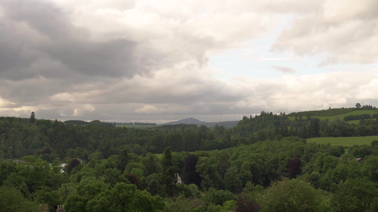 Scottish Landscape covered in Woodland and Farmhouses