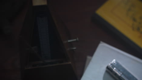 metronome set the rythm in the dark, old room