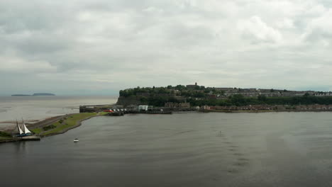 Aerial-Flyover-of-Cardiff-Bay-towards-Penarth-Peninsula-and-the-Bristol-Channel-on-a-Cloudy-Day-in-Summer